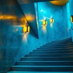 A photograph of a beautifully designed stairwell illuminated by stylish light fixtures
