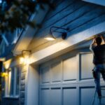 A photograph of a well-lit garage exterior showcasing stylish and functional light fixtures