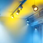 A photograph of a well-lit indoor space featuring 8-foot track lighting installations