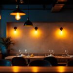 A photograph of a beautifully illuminated restaurant interior showcasing various lighting designs