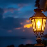 A photograph of a beautifully designed nautical lamp post illuminated at dusk
