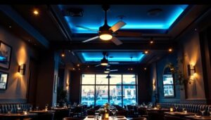 A photograph of a stylish restaurant interior featuring elegant ceiling fans and ambient lighting