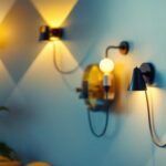 A photograph of a stylish and eclectic selection of funky wall sconces in a well-lit interior setting
