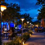A photograph of a vibrant outdoor setting illuminated by sleek