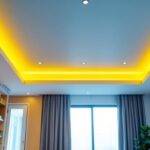A photograph of a well-lit interior space showcasing a modern drop ceiling with stylish recessed lighting