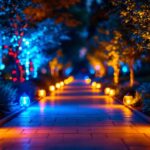 A photograph of a beautifully illuminated outdoor pathway featuring vibrant color-changing lights