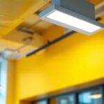 A photograph of a modern led troffer light fixture installed in a contemporary office space