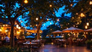 A photograph of a beautifully illuminated outdoor restaurant setting at dusk
