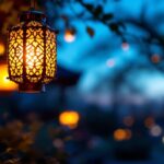 A photograph of a beautifully illuminated solar-powered soji lantern hanging in a serene outdoor setting at dusk