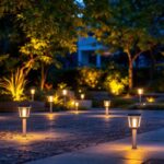 A photograph of a beautifully illuminated outdoor space featuring high-quality solar lights in various settings