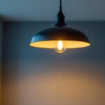 A photograph of a stylish hanging ceiling light fixture in a well-lit room