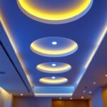 A photograph of a beautifully designed ceiling with recessed lighting fixtures that seamlessly blend into the architecture