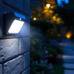 A photograph of a well-lit outdoor space showcasing a motion sensor security light in action