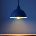A photograph of a stylish led hanging light fixture elegantly illuminated in a modern interior setting