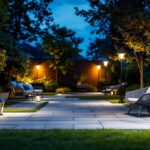 A photograph of a well-lit outdoor space showcasing various solar lights in use
