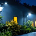 A photograph of a well-lit outdoor area showcasing various types of security lights in use