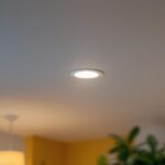 A photograph of a well-lit room featuring a close-up of a 6-inch recessed lighting trim