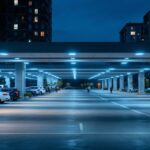 A photograph of a modern parking lot illuminated by energy-efficient led lighting