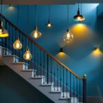 A photograph of a beautifully designed staircase featuring a variety of stylish hanging lights