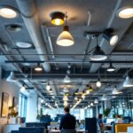 A photograph of a well-lit workspace featuring recessed shop lights installed in a commercial setting