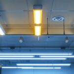 A photograph of a well-lit installation featuring tombstone fluorescent light fixtures