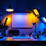 A photograph of a well-lit workspace featuring a variety of uv lights in different styles and applications