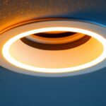 A photograph of a close-up of a 6-inch recessed light trim ring installed in a modern ceiling