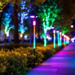 A photograph of a well-lit outdoor scene featuring color-changing led lights installed along a pathway or in a public space