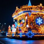 A photograph of a beautifully illuminated parade float featuring festive holiday decorations