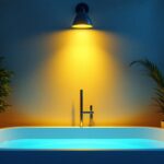 A photograph of a well-lit interior space featuring a stylish tub light installation