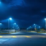 A photograph of a well-lit parking lot showcasing rab parking lot lights in action during dusk or nighttime