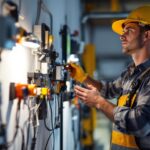 A photograph of a lighting contractor in action