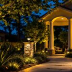 A photograph of a beautifully illuminated outdoor landscape featuring satco landscape lighting fixtures in use