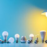 A photograph of a variety of led bulbs displayed alongside different types of light fixtures