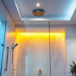 A photograph of a well-designed bathroom featuring recessed shower lights