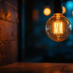 A photograph of a vintage lightbulb glowing warmly in a modern lighting design setting