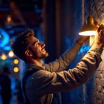 A photograph of a lighting contractor skillfully installing or adjusting a stylish light fixture in a beautifully illuminated space