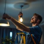 A photograph of a skilled lighting contractor expertly installing a stylish hanging fixture in a modern interior