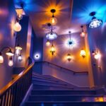 A photograph of a beautifully illuminated staircase ceiling featuring a variety of stylish light fixtures