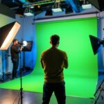 A photograph of a well-lit green screen setup in a professional studio
