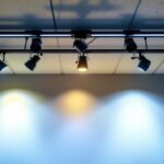 A photograph of a well-lit room featuring low voltage ceiling spotlights in action