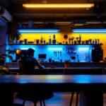 A photograph of a modern workspace or commercial setting illuminated by vibrant fluorescent lighting