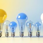 A photograph of a variety of light bulbs with different base sizes arranged aesthetically