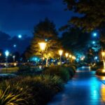 A photograph of a beautifully illuminated outdoor space featuring various night lighting installations