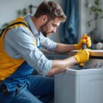 A photograph of a skilled lighting contractor expertly installing a washer and dryer plug in a modern laundry room