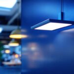 A photograph of a sleek 1x4 light fixture installed in a modern commercial space