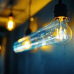 A photograph of a vintage fluorescent light bulb illuminated in a modern setting