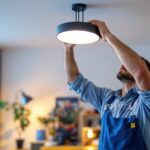 A photograph of a lighting contractor installing a sleek