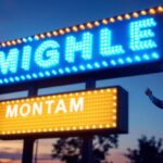 A photograph of a well-lit led monument sign at dusk