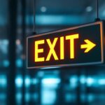 A photograph of a well-lit emergency exit sign in a commercial building